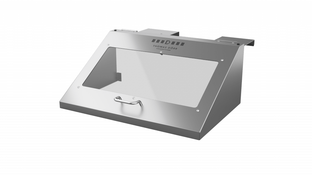 Ein Gehäuse aus rostfreiem Stahl mit einer transparenten Frontplatte, einem Griff an der Unterseite und dem Markennamen "Thomas Dörr" oberhalb des Fensters. Das Gehäuse ist abgewinkelt und hat oben Befestigungsklammern.