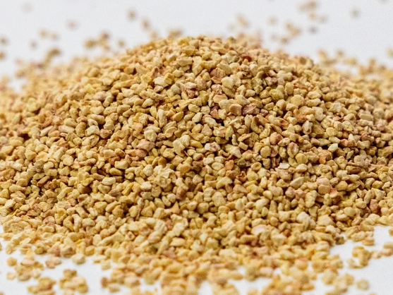 A pile of granules on a white background.